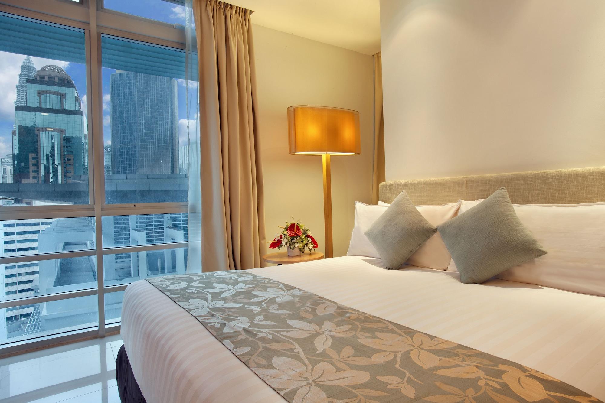 Parkroyal Serviced Suites Kuala Lumpur Cameră foto A bedroom at the hotel