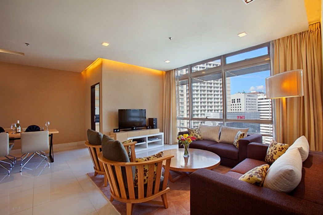 Parkroyal Serviced Suites Kuala Lumpur Exterior foto A living room in a serviced apartment in Singapore