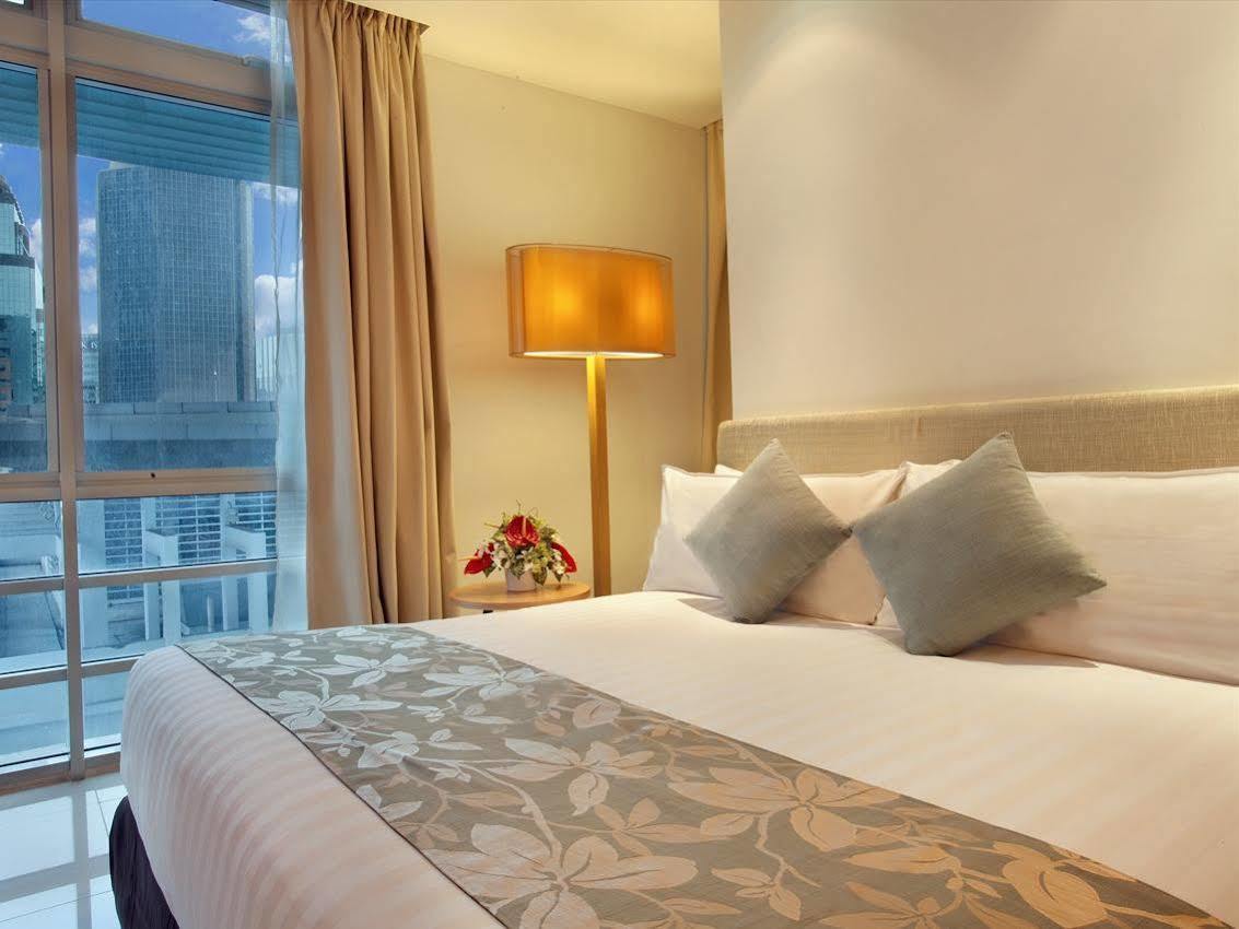 Parkroyal Serviced Suites Kuala Lumpur Exterior foto A bedroom at the hotel